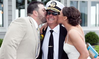 View Photo #6 - Bride and groom kissing captain