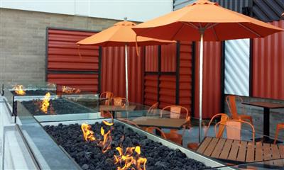 View Photo #2 - Blaze outdoor table seating along fire lit coal 
