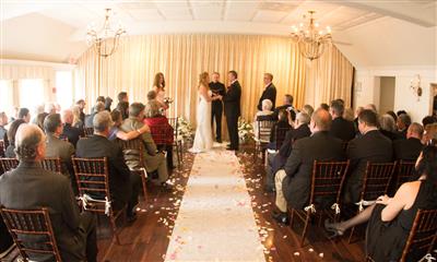View Photo #16 - Bride and groom during wedding ceremony