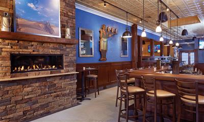 View Photo #25 - Indoor fireplace and table seating