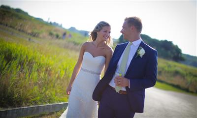 View Photo #13 - Bride and groom walking side by side outdoors