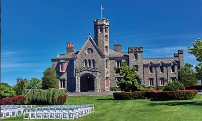 View Photo #6 - View of the Castle from the Front Lawn with Chairs Set Up For a Wedding