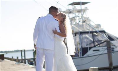 View Photo #7 - Couple Kissing With Boat in Background