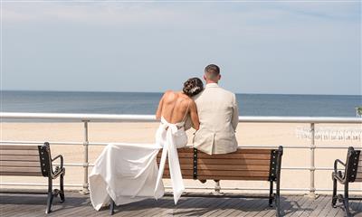 View Photo #9 - bride and groom sitting on a bench